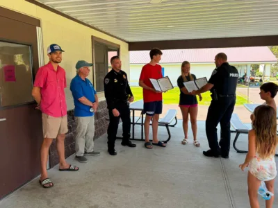 Lifeguards honored for help in bicycle-car accident